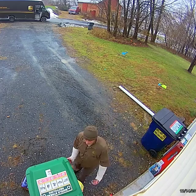 UPS delivery man goes the extra level to hide the package.